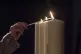 Memorial candles are lit during a Holocaust Memorial Day com