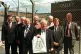 VINDICATED: Mike Grindley (centre) holds up his famous
bag 