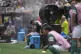 Palmeiras' Vitor Roque sits on the side of the pitch in a cooling mist after being substituted during the Club World Cup round of 16 soccer match between Palmeiras and Botafogo in Philadelphia, June 29, 2025