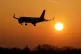 An EasyJet plane landing during sunrise at London Gatwick Airport in Crawley, West Sussex