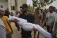 A relative carries the body of Palestinian child Muath Al-Basus, who was killed in an Israeli military strike, during his funeral outside Shifa Hospital in Gaza City, September 4, 2025