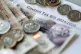 Money stacked on top of a council tax bill