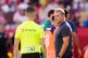 Barcelona's head coach Hansi Flick looks at the referee after the Spanish La Liga soccer match between Sevilla and Barcelona at the Ramon Sanchez Pizjuan stadium in Seville, Spain, October 5, 2025