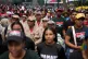 People gather outside of the United Nations' office in Caracas, Venezuela, for a government-organised rally against foreign interference, October 6, 2025