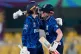 England's Heather Knight, right, and England's Charlotte Dean celebrate after winning the ICC Women's Cricket World Cup match against Bangladesh at Barsapara Cricket Stadium in Guwahati, India, Tuesday, Oct. 7, 2025
