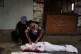  Yahya Eid mourns over the body of his 10-year-old nephew, Shabaan Eid, who was killed in an Israeli army strike on the Bureij camp, during his funeral at Al-Awda Hospital in Nuseirat, central Gaza Strip, October 29, 2025