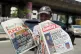 A vendor sells local newspapers with headlines referring to US President Donald Trump's comments about Nigeria, on the street of Lagos, Nigeria, Sunday, Nov. 2, 2025
