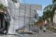 A damaged building blocks a road in Dak Lak, Vietnam on Friday, Nov. 7, 2025 after Typhoon Kalmaegi lashed Vietnam with fierce winds and torrential rains