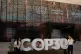 People pose for photos outside the venue for the Cop30 UN Climate Summit, in Belem, Brazil, November 8, 2025