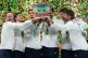 Italian tennis team members hold the Davis Cup trophy after the final between Italy and Spain, in Bologna, Italy, November 23, 2025