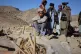 An Afghan boy sits beside the rubble of a home struck in an overnight attack that, according to an Afghan government spokesman, was carried out by Pakistan, in the Gurbaz district of Khost province, Afghanistan, November 25, 2025