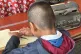 EDUCATED FUTURE: A small boy produces words on a Braille typewriter / Pic: author supplied