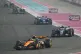 McLaren driver Lando Norris of Britain steers his car followed by Mercedes driver Andrea Kimi Antonelli of Italy during the Qatar Formula One Grand Prix, at the Lusail International Circuit, in Lusail, Qatar, November 30, 2025