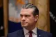 Us Defence Secretary Pete Hegseth listens as President Donald Trump speaks during a Cabinet meeting at the White House, December 2, 2025