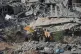 Islamic Jihad and Hamas militants search for the remains of deceased hostages in Beit Lahiya, northern Gaza Strip, December 3, 2025