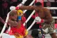 Anthony Joshua, right, punches Jake Paul during their heavyweight boxing match, Friday, Dec. 19, 2025, in Miami, Fla