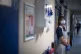 A support worker stands in a corridor of NHS Seacole Centre at Headley Court, Surrey, May 2020