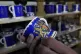 A worker checks the quality of official chinaware at a pottery factory in Stoke-on-Trent where the official Coronation chinaware is produced on behalf of Royal Collection Trust, April 13, 2023