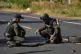 Members of a Thai Explosive Ordnance Disposal team inspect the site of a rocket attack during clashes between Thai and Cambodian soldiers in Kantharalak district of Sisaket province, Thailand, December 15, 2025