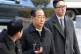 Former South Korean Prime Minister Han Duck-soo, center, arrives at the Seoul Central District Court for his first sentencing trial in the insurrection case, in Seoul, January 21, 2026