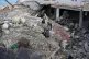 People look through the rubble of a destroyed building that was hit by an Israeli airstrike at a commercial district in the southern port city of Sidon, Lebanon, January 6, 2026