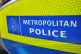 A Metropolitan Police sign on the side of a police vehicle