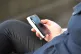 A woman using a mobile phone in central London
