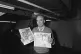 Newspaper proprietor Rupert Murdoch holds copies of The Sun and Times papers, at his new high technology print works in Wapping, East London