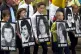 Children in Glasgow city centre carry pictures of the hunger-strikers, during a Republican rally to commemorate the 20th anniversary of the IRA hunger-strike at the Maze prison in Northern Ireland, May 2001