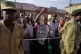 A supporter of leading opposition candidate Bobi Wine cheers while watching election officials count ballots, after polls closed at a polling station in Kampala, Uganda, January 15, 2026