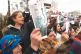 ETHNIC STRIFE: Women condemn, yesterday, a video in circulation that allegedly shows a fighter affiliated with the Syrian government holding the braid of a Kurdish female fighter after killing her, in Qamishli, northeastern Syria