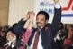 Democratic presidential hopeful Jesse Jackson with his wife, Jacqueline, salutes the cheering crowd at Operation Push in Chicago, March 10, 1988