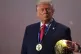 President Donald Trump stands on stage next to the FIFA World Cup after receiving the FIFA Peace Prize during the draw for the 2026 soccer World Cup at the Kennedy Center in Washington, December 5, 2025