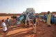 People fill water containers at a free distribution point due to water outages in Khartoum, Sudan, on January 30, 2026