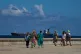 Tourists walk along the seafront promenade while a tanker exits Havana, Cuba, February 14, 2026