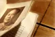 A rare first edition copy of Chairman Mao Tse-tung's 'Little Red Book' lies on a table at Bonhams auction house in central London