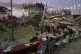 Palestinians gather amid the rubble of destroyed buildings as they gather for their fast-breaking meal during the Muslim holy month of Ramadan, in Khan Younis, Gaza Strip, February 19, 2026