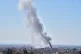 A plume of smoke rises after a strike in Tehran, Iran, March 1, 2026