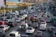 Displaced people fleeing Israeli strikes in southern Lebanon sit in traffic at a highway links to Beirut, in the southern port city of Sidon, March 2, 2026