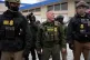 US Border Patrol Commander Gregory Bovino walks with federal agents outside a convenience store in Minneapolis, January 21, 2026