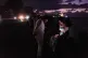 People spend the night in the dark on the Malecon during a blackout in Havana, Cuba, March 21, 2026