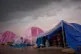Children displaced from Beirut's southern suburb of Dahiyeh shelter from the rain inside their tents along the coast in Beirut, Lebanon, March 26, 2026