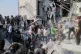 Rescue workers and residents search through the rubble in the aftermath of what Iranian officials said was an Israeli-U.S. strike on a girls' elementary school in Minab, Iran, February 28, 2026