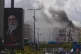 A portrait of Iran's late Supreme Leader Ayatollah Ali Khamenei (left) is seen, as smoke rises following an Israeli airstrike in Dahiyeh, Beirut's southern suburbs, Lebanon, March 30, 2026