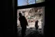 Workers remove debris at Tehran's Sharif University of Technology complex that Iranian authorities say was hit early Monday by a U.S.-Israeli strike, in Tehran, Iran, April 6, 2026