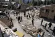 Journalists from foreign media based in Tehran document damage from U.S.-Israeli strikes in a residential area of the town of Fardis, west of Tehran, Iran, April 3, 2026