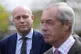Reform UK leader Nigel Farage speaks to members of the media ahead of a walkabout in Merthyr Tydfil, South Wales, on the campaign trail for the upcoming Senedd election, April 16, 2026