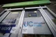 A Universal Credit sign on a door of a job centre plus in east London