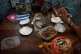 A souvenir shop worker eats next to images of Che Guevara, Fidel Castro, and Ernest Hemingway in Havana, Tuesday, June 2, 2026