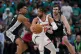 New York Knicks guard Jalen Brunson (11) spins as San Antonio Spurs guard Dylan Harper, left, defends during the first half of Game 1 of the NBA Finals basketball series, June 3, 2026, in San Antonio